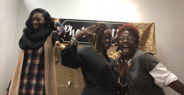Our family striking playful poses at a photo booth